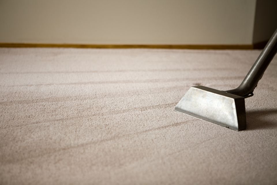 A carpet cleaning machine cleans a room, highlighting a professional carpet restoration service in Las Vegas, NV.